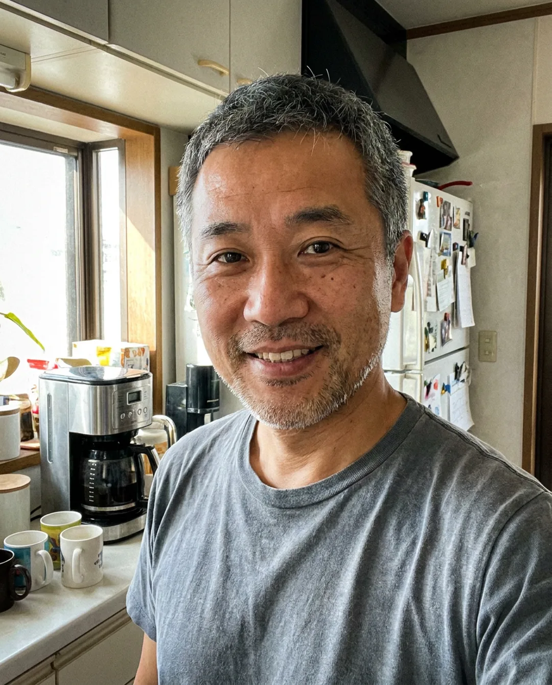 Kenji, one of the ready-made UGC Swap characters, in a phone selfie in his kitchen.